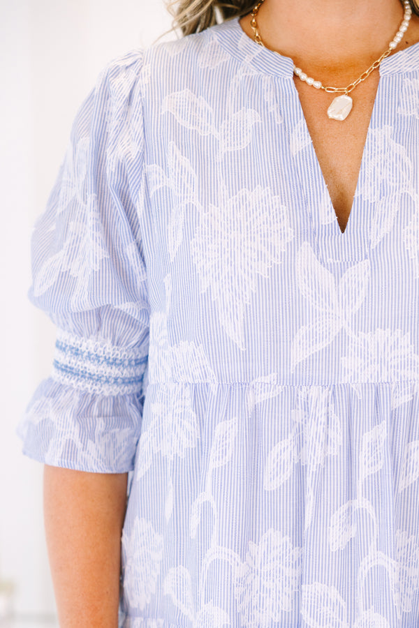 Plus Size blue and white striped tiered midi dress with floral print and puff sleeves.