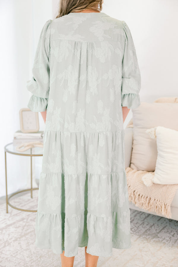 Chic Soul plus size clothing, sage tiered midi dress with half sleeves that have a ruffle detail at the end of each sleeve as well as a subtle floral pattern throughout and a slight v-neckline 
