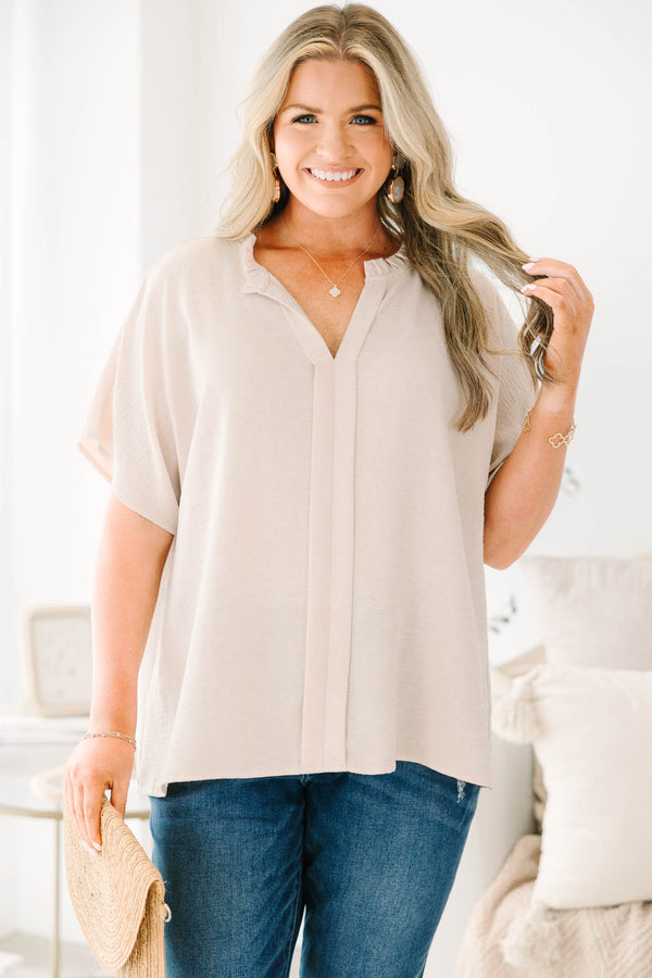 Plus Size dark wash skinny jeans with distressed details and cuffed hems.