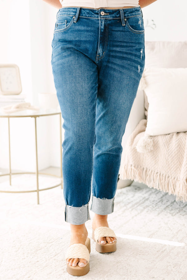 Plus Size dark wash skinny jeans with distressed details and cuffed hems.