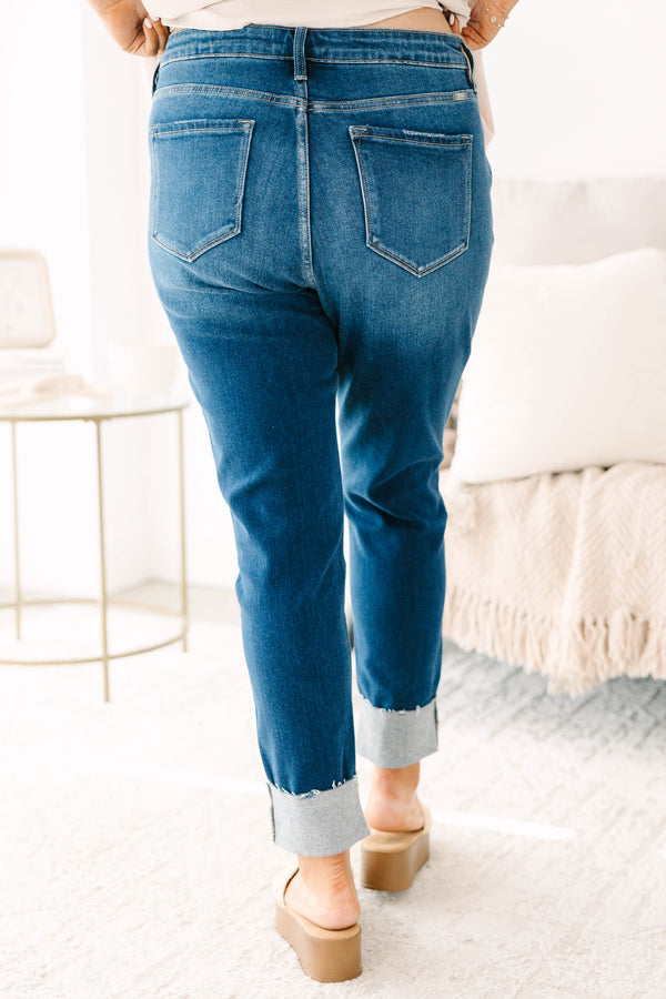 Plus Size dark wash skinny jeans with distressed details and cuffed hems.