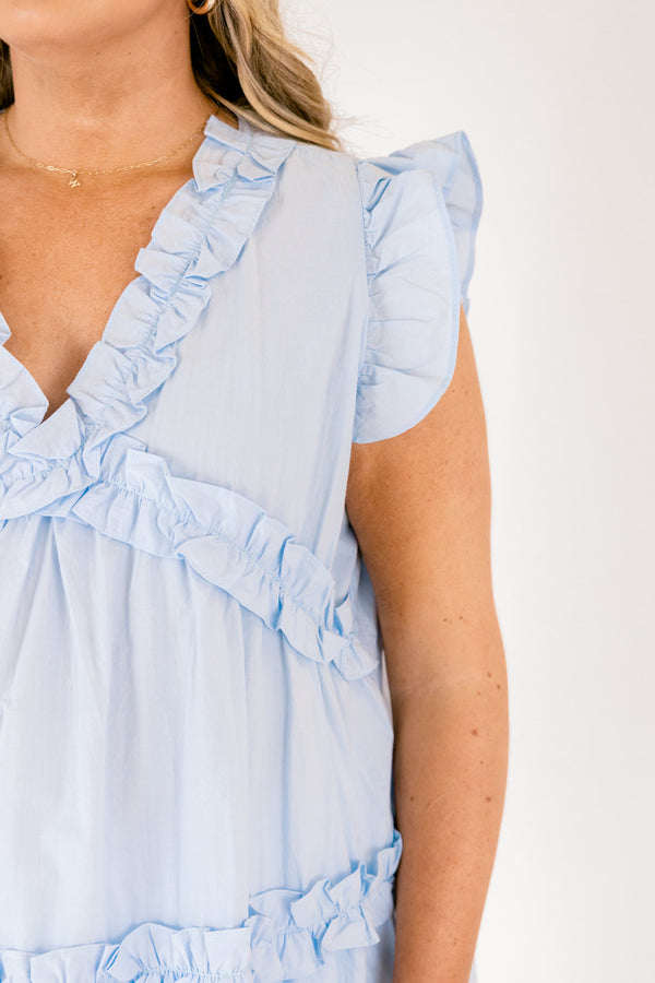 Plus Size light blue cotton top with flutter sleeves, a v-neckline, and tiered ruffle details.