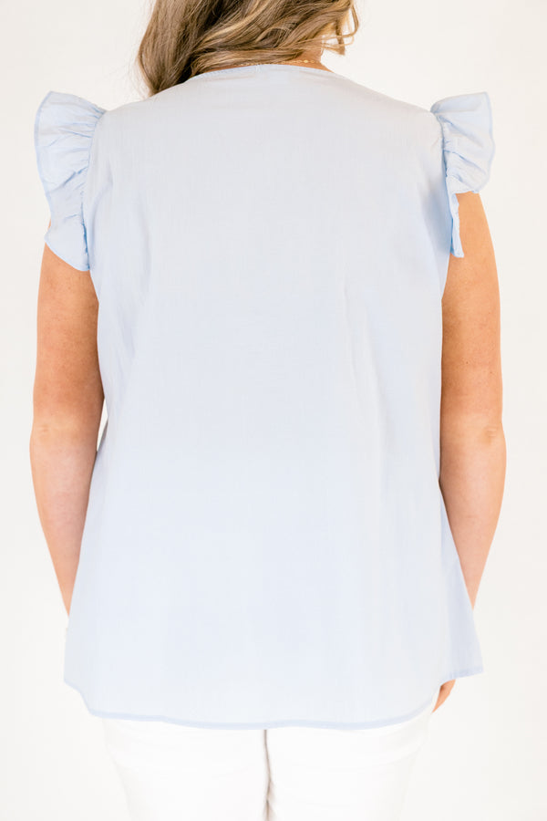 Plus Size light blue cotton top with flutter sleeves, a v-neckline, and tiered ruffle details.