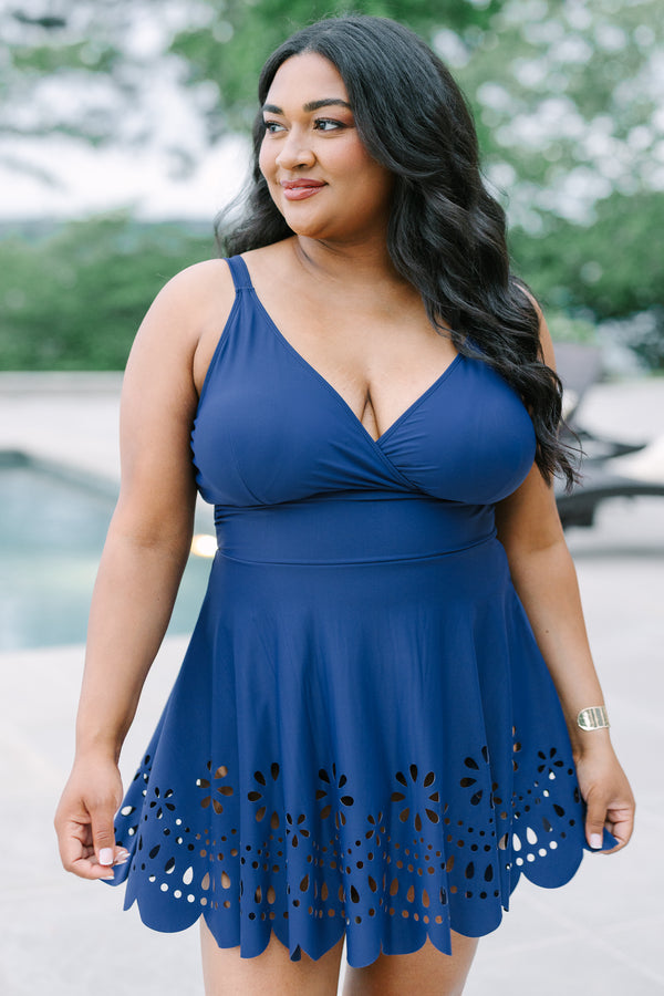 Plus Size navy blue swim dress with a surplice neckline and laser-cut floral hem.