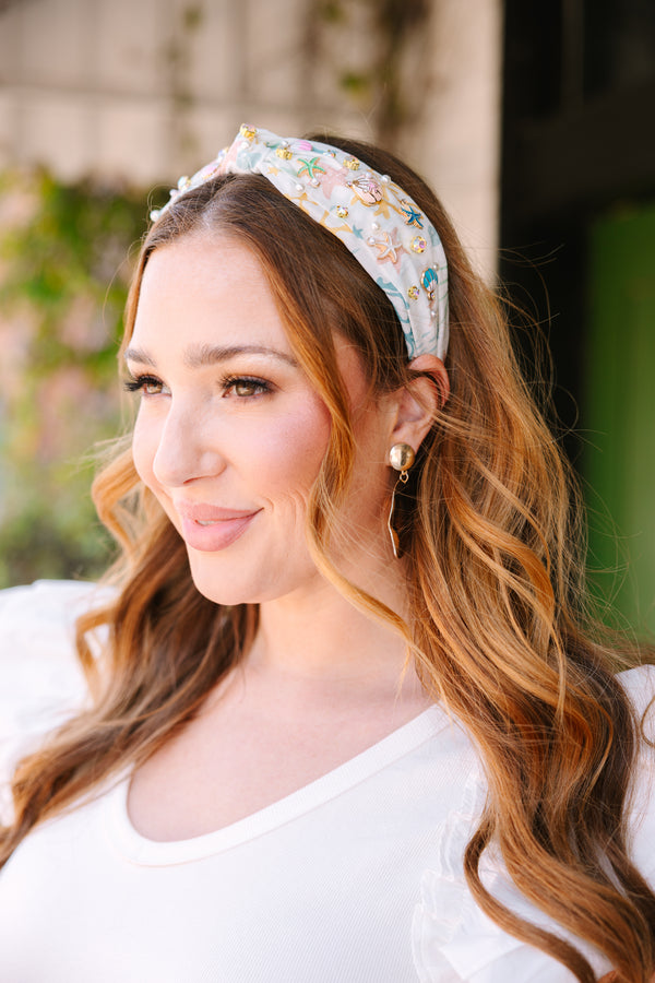 Chic Soul plus size clothing, white headband with a blue wave pattern as well as a knot look on the center of the headband and beach charms throughout 