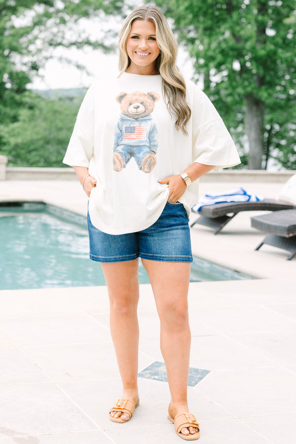 Ivory oversized boyfriend tee featuring a graphic of a teddy bear in a patriotic hoodie.