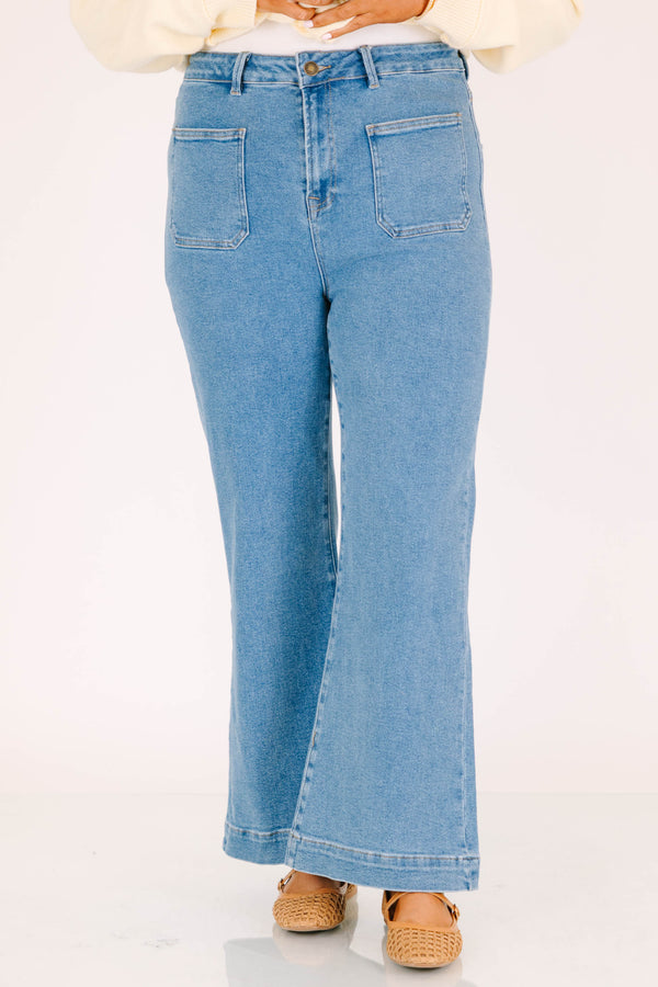 Plus size classic wash wide leg jeans with front patch pockets and a flattering high-waisted fit.