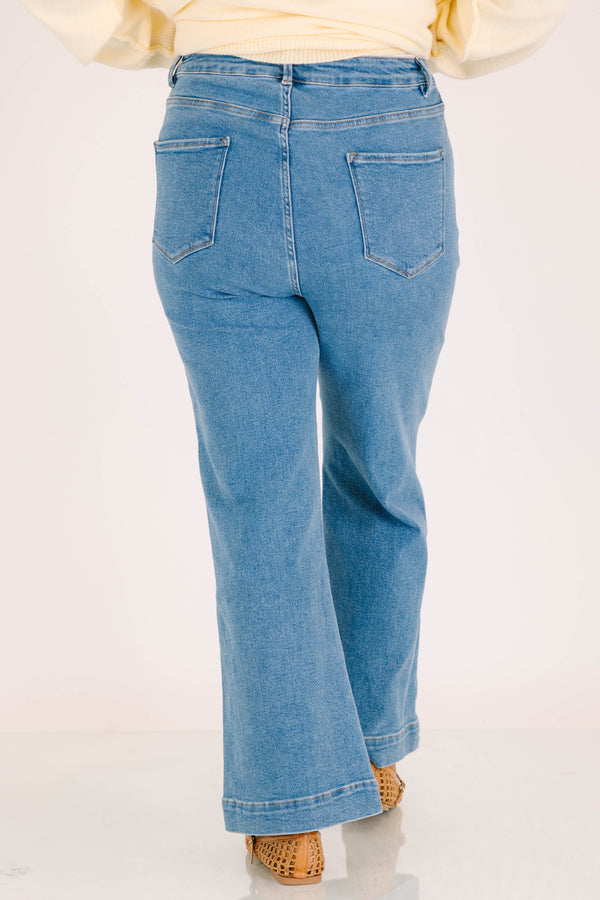Plus size classic wash wide leg jeans with front patch pockets and a flattering high-waisted fit.