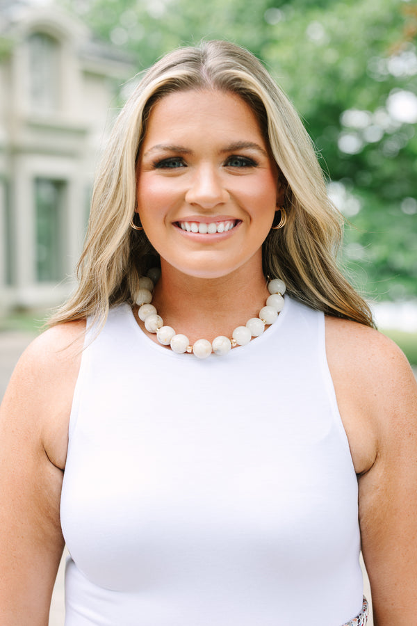 Plus Size ivory beaded necklace with gold spacers and an adjustable chain clasp.