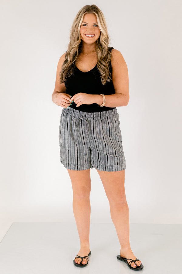 Chic Soul plus size clothing, gray striped shorts with pockets on the front of the shirts ad a draw string waistband that has a bow that ties in the center of the shorts 