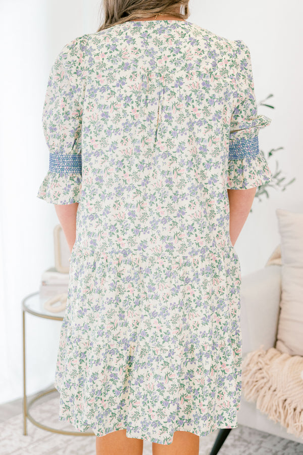 Chic Soul plus size clothing, cream taupe knee length dress with half sleeves that have a ruffle detail at the end of them as well as blue stitching details above the ruffle and a floral pattern throughout the dress 