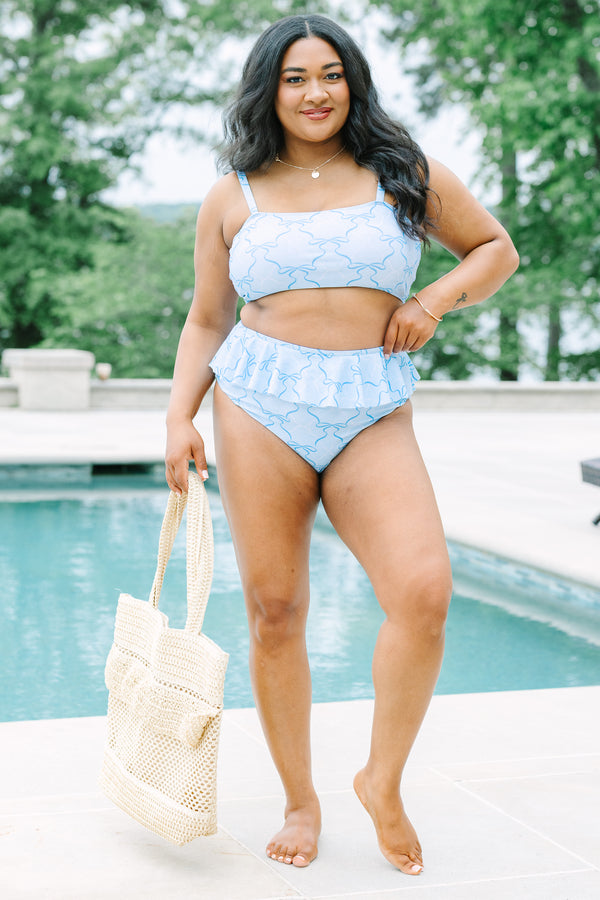 Plus Size high-waisted light blue bikini bottoms with a ruffled waist and dark blue ribbon pattern.