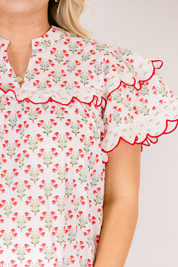Chic Soul plus size clothing, white short flutter sleeve top with pink and green small floral pattern and pink scallop trimming along the sleeves through the top