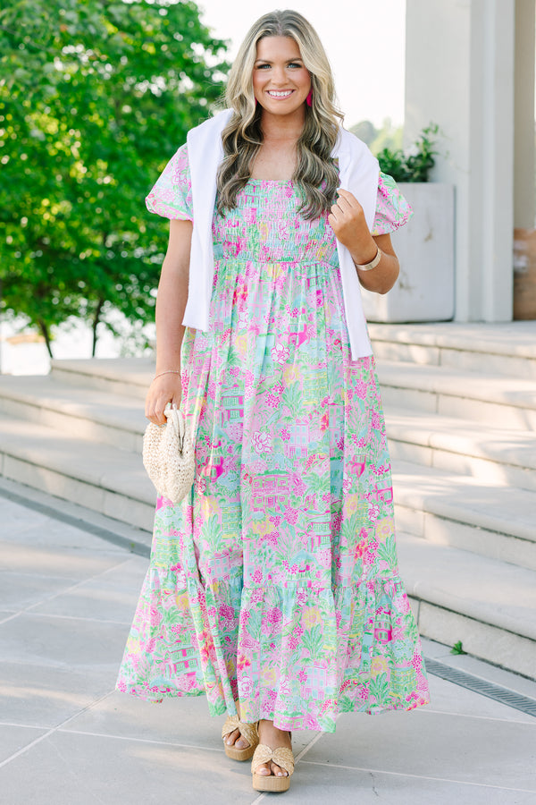 Pink floral maxi dress with a smocked bodice, square neckline, and short bubble sleeves.