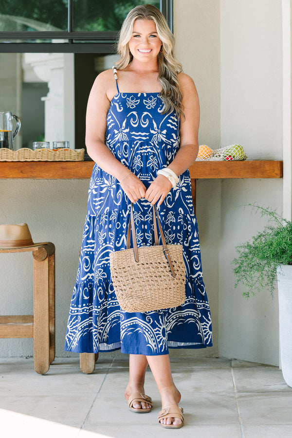 Plus Size cobalt blue midi dress with a white batik-style print, tiered skirt, and thin straps.