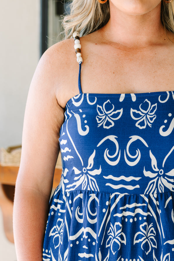 Plus Size cobalt blue midi dress with a white batik-style print, tiered skirt, and thin straps.