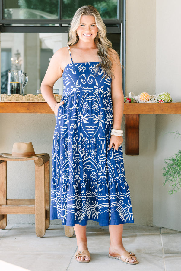 Plus Size cobalt blue midi dress with a white batik-style print, tiered skirt, and thin straps.