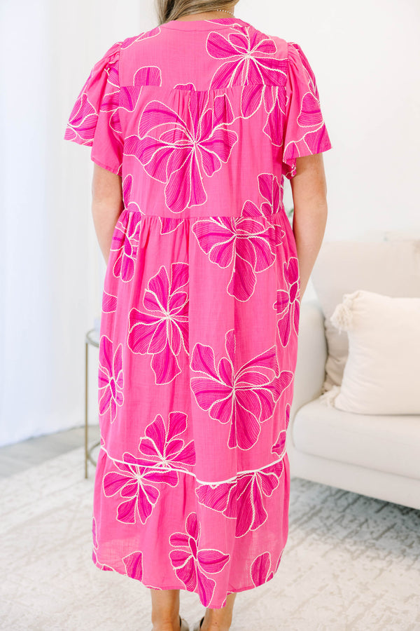 Plus Size pink midi dress with white floral embroidery, V-neckline, and short flutter sleeves.