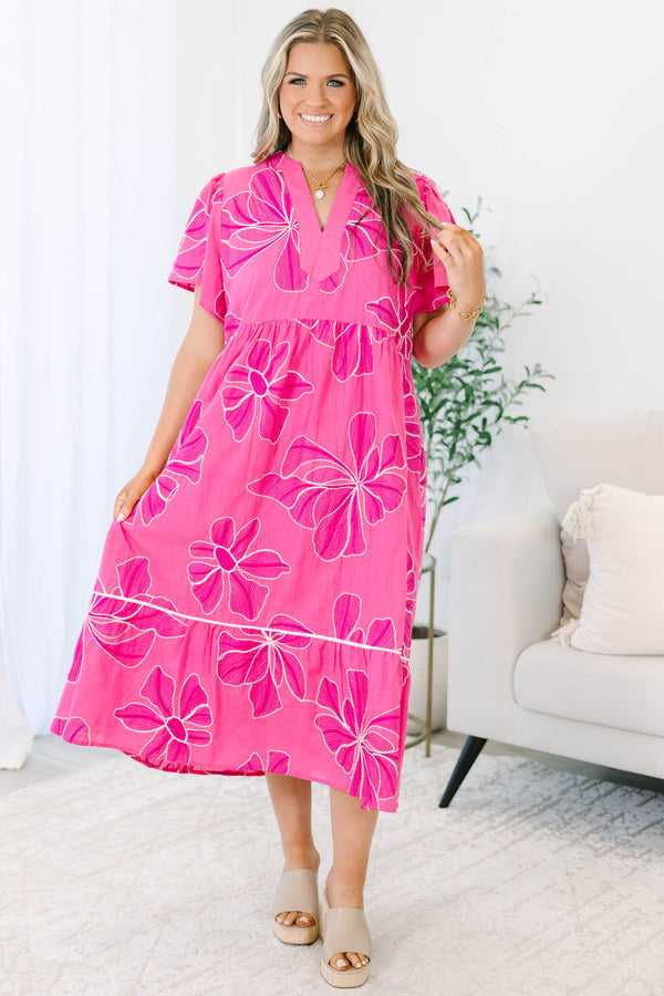 Plus Size pink midi dress with white floral embroidery, V-neckline, and short flutter sleeves.