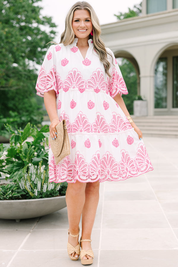 Plus Size white babydoll dress with pink eyelet embroidery, split v-neckline, and tiered skirt.