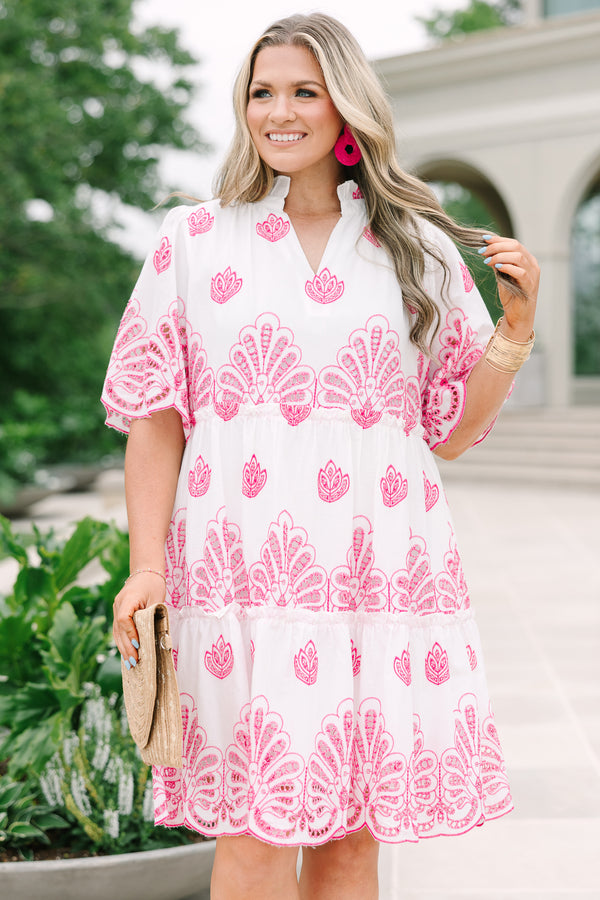 Plus Size white babydoll dress with pink eyelet embroidery, split v-neckline, and tiered skirt.