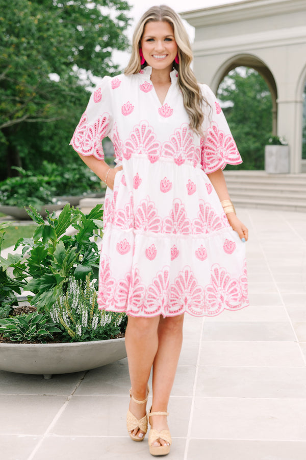 Plus Size white babydoll dress with pink eyelet embroidery, split v-neckline, and tiered skirt.