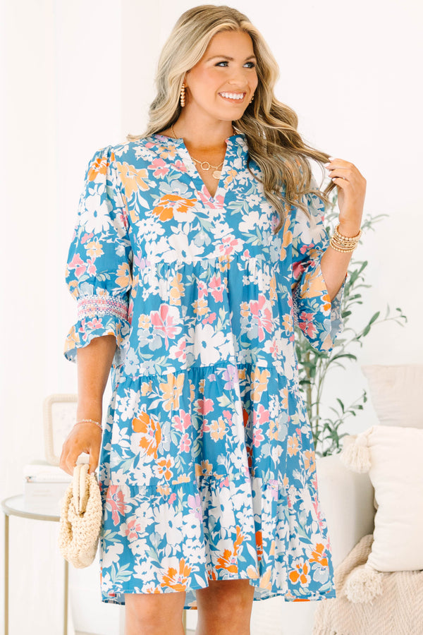 Plus size blue floral mix dress with a flowy tiered silhouette, V-neckline, and ruffle sleeves.