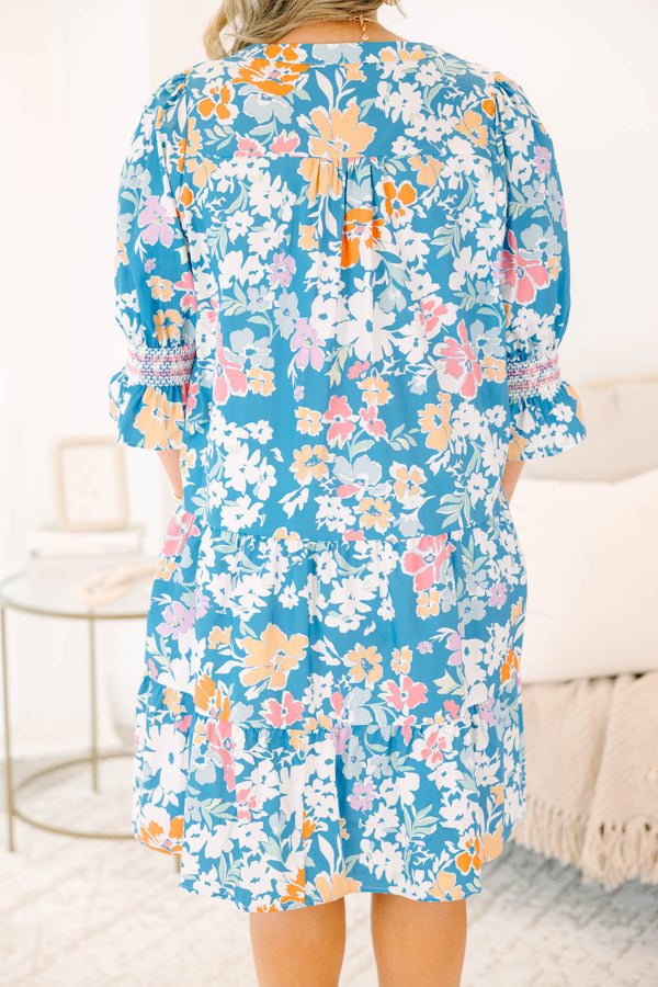 Plus size blue floral mix dress with a flowy tiered silhouette, V-neckline, and ruffle sleeves.