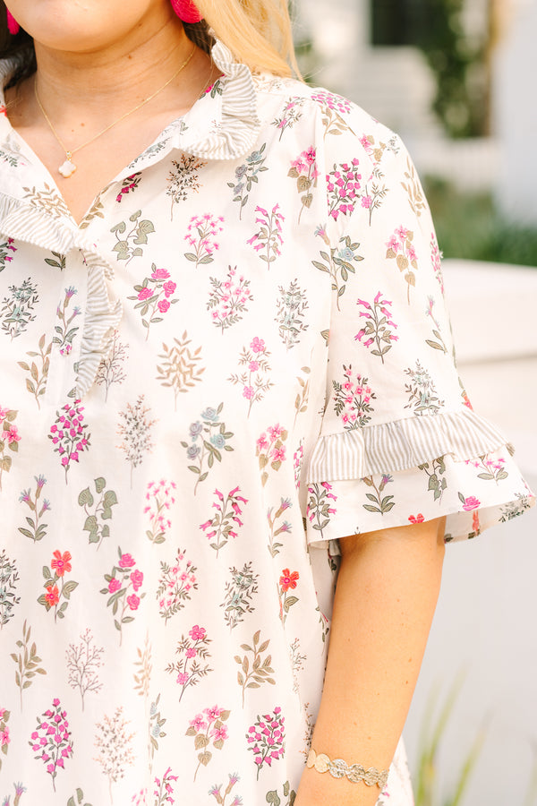 Chic Soul plus size clothing, cream short ruffle sleeve top with pink block floral print and a ruffle v neckline cutout