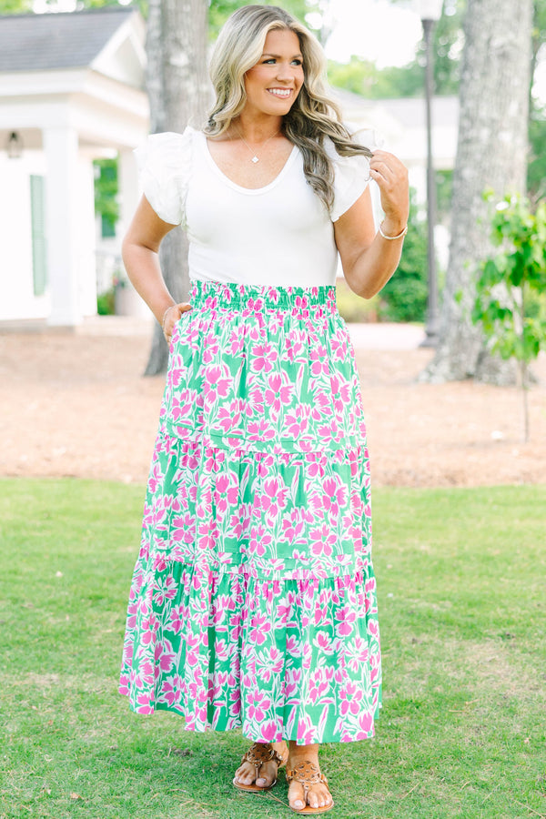 Plus Size tiered maxi skirt in a pink and green floral print with an elastic waistband.