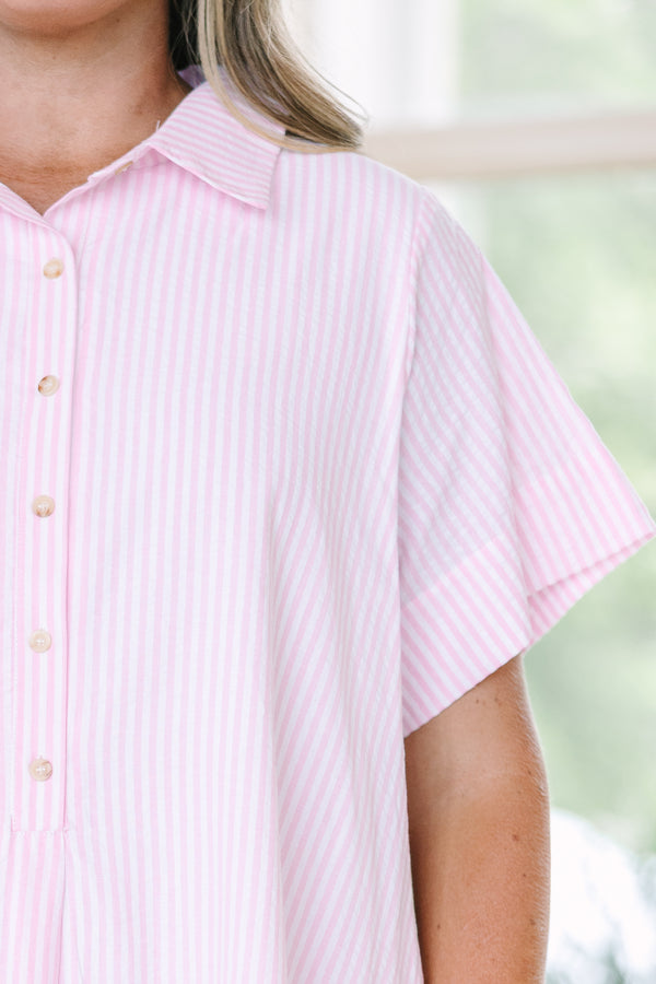 Plus size pink and white striped A-line shirt dress with a collared neckline and short sleeves.