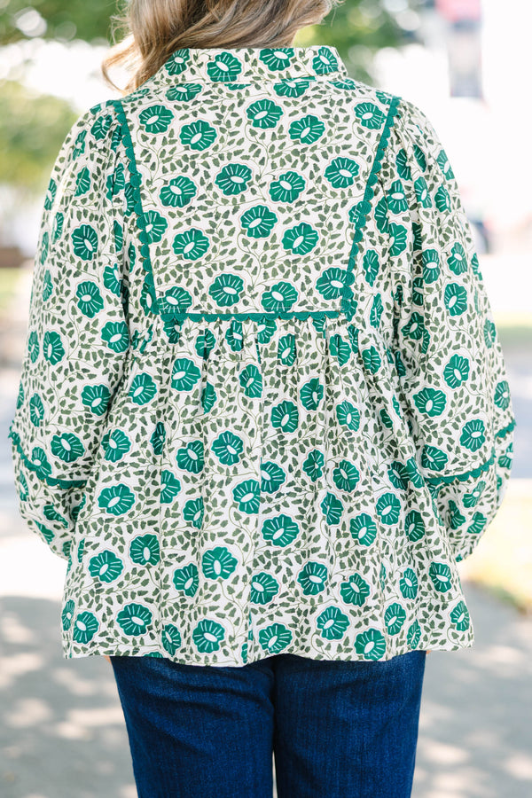 Plus Size green floral print top with long sleeves, a V-neckline, and a loose, flowy fit.