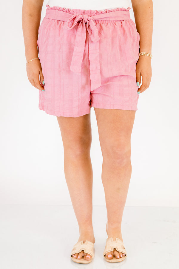 Chic Soul plus size clothing, light pink mid thigh length linen shorts with a tie belt at the waist and 2 front pockets at the hips