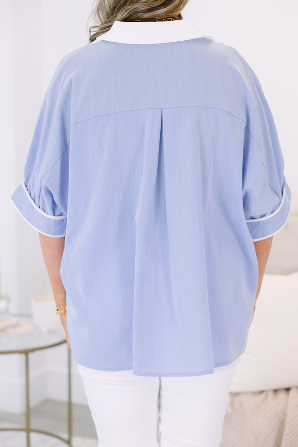 Plus Size light blue v-neck tunic top with white trim and short puff sleeves.