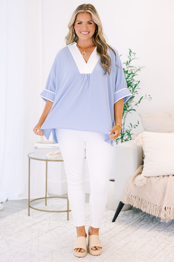 Plus Size light blue v-neck tunic top with white trim and short puff sleeves.