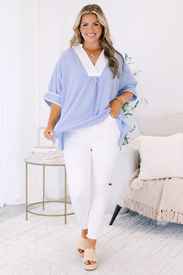 Plus Size light blue v-neck tunic top with white trim and short puff sleeves.