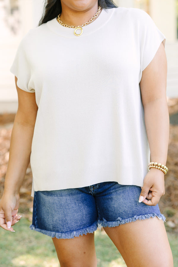 Plus Size oatmeal short sleeve knit sweater with a crew neckline and ribbed hem.