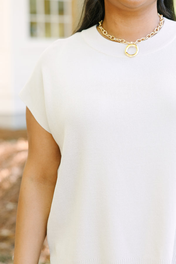 Plus Size oatmeal short sleeve knit sweater with a crew neckline and ribbed hem.