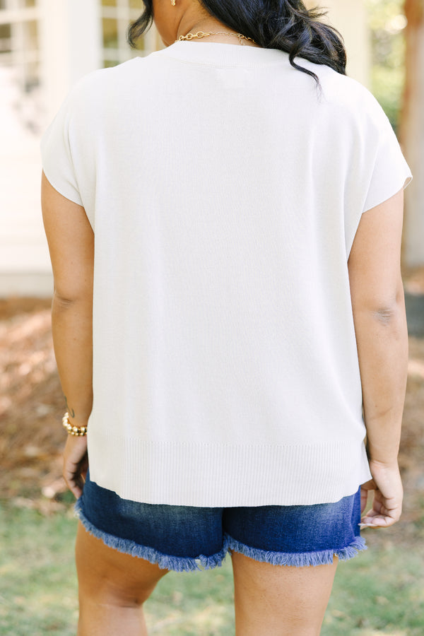 Plus Size oatmeal short sleeve knit sweater with a crew neckline and ribbed hem.