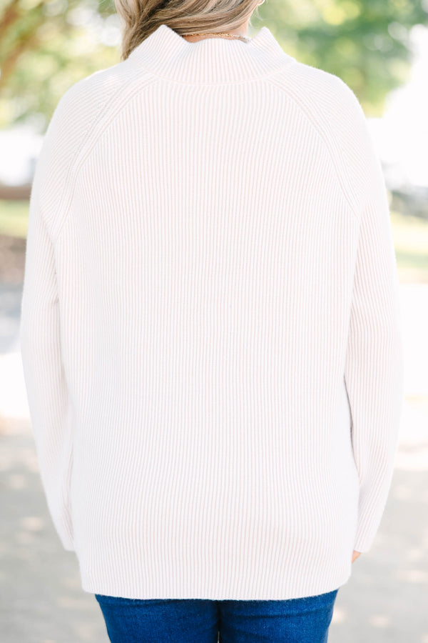 Plus size cream ribbed quarter-zip sweater with a cozy, relaxed fit and long sleeves.