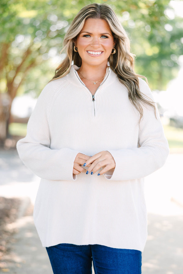 Plus size cream ribbed quarter-zip sweater with a cozy, relaxed fit and long sleeves.