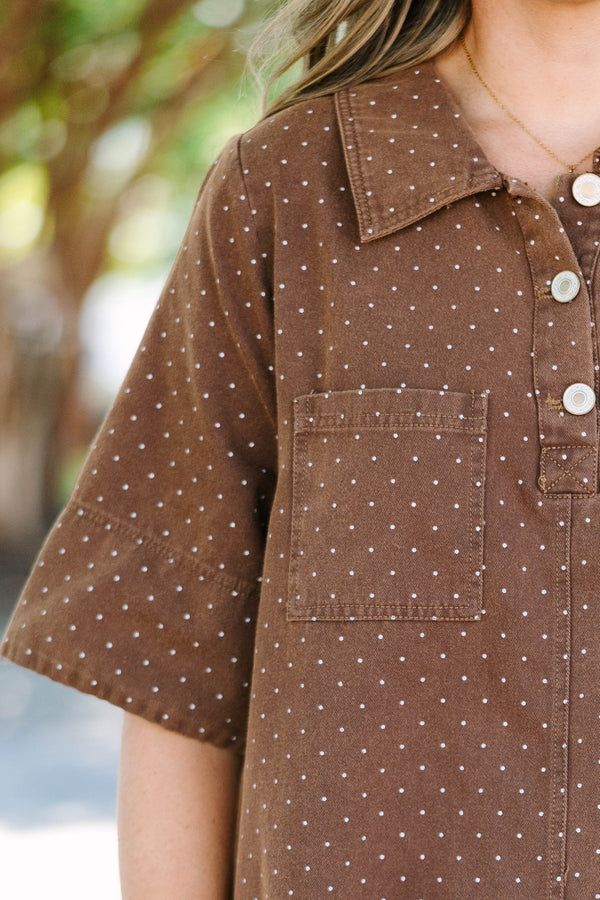 Plus Size brown short sleeve polo dress with white polka dots, collar, and front pockets.