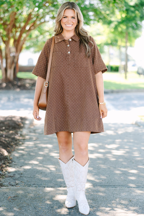 Plus Size brown short sleeve polo dress with white polka dots, collar, and front pockets.