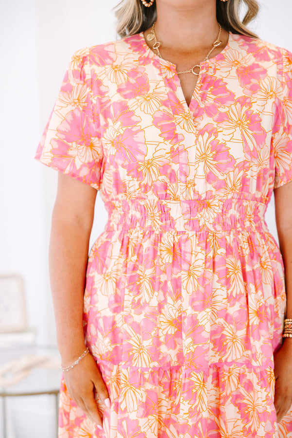 Plus Size pink and orange floral print midi dress with a V-neckline and tiered skirt.