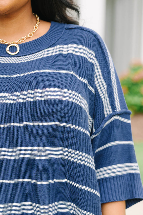 Plus size navy and white striped sweater with a flowy fit, crew neck, and elbow-length sleeves.