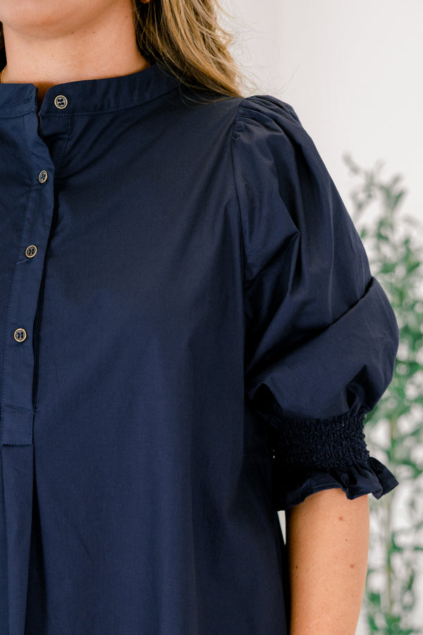 Chic Soul plus size clothing, navy knee length dress with half sleeves that have a ruffle detail at the end of each sleeves and buttons going down to the chest area 