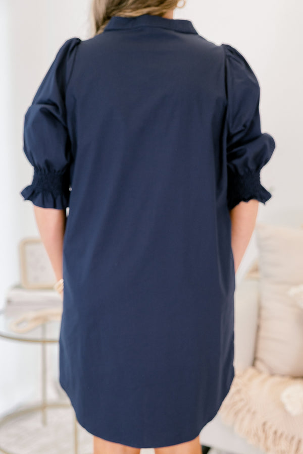 Chic Soul plus size clothing, navy knee length dress with half sleeves that have a ruffle detail at the end of each sleeves and buttons going down to the chest area 