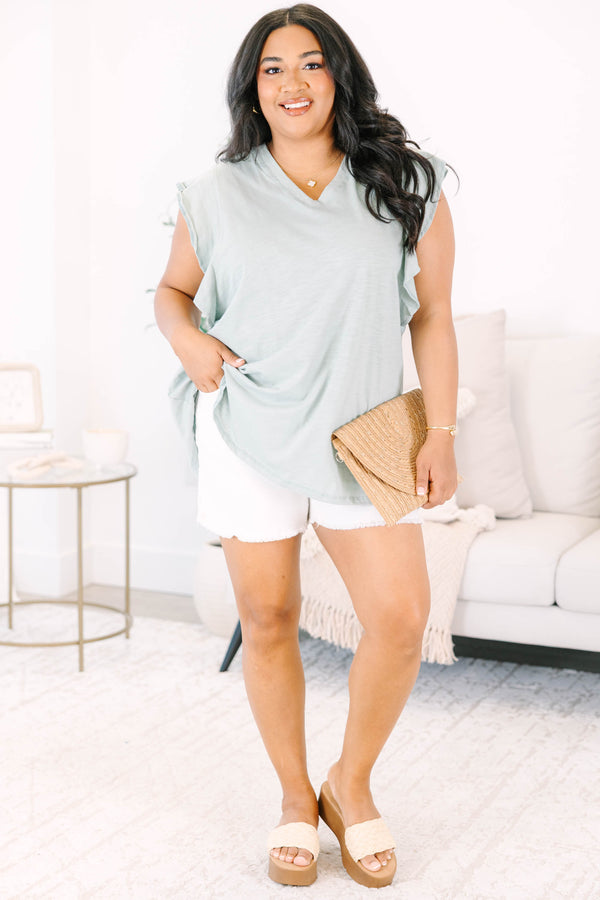 Plus Size light sage v-neck top with ruffled cap sleeves and a relaxed fit.