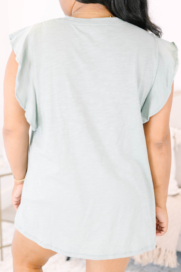 Plus Size light sage v-neck top with ruffled cap sleeves and a relaxed fit.