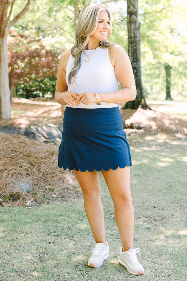 Plus Size navy blue athleisure skort with a scalloped hemline and comfortable pull-on design.